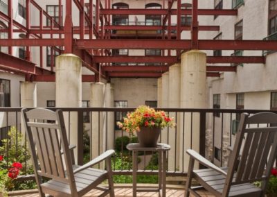 Private apartment balcony facing the interior courtyard at Chocolate Works apartments