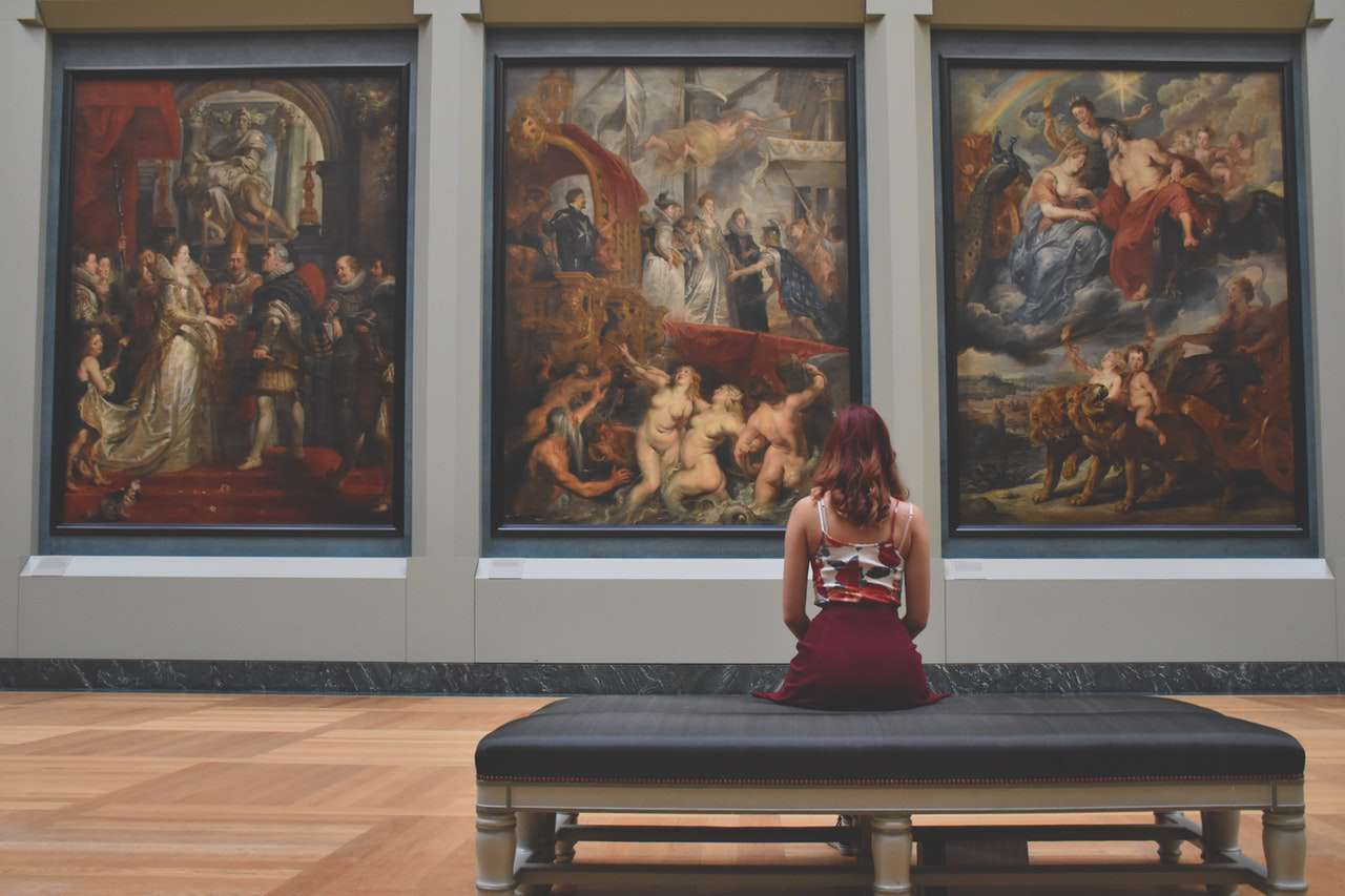 Woman looking at a piece of art near our apartments in Old City.