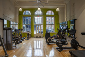 Fitness center at Chocolate Works Old City apartments