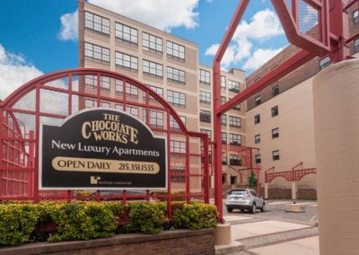 Exterior sign at Chocolate Works apartments located at 231 N. Third St in Philadelphia, PA 19106